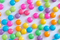 Pile of colorful sweet candy chocolates coated on white paper. c Royalty Free Stock Photo