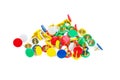 Pile of colorful thumbtacks on white