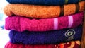 pile of colorful towels in wardrobe