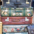 Pile of colorful vintage suitcases.