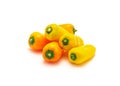 Pile of colorful yellow and orange mini sweet peppers snack isolate on white Royalty Free Stock Photo