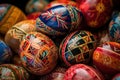 a pile of colorfully painted eggs sitting on top of each other on a tablecloth covered tablecloth covered tablecloth with a