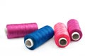Pile of coloured bobbins of lurex thread Royalty Free Stock Photo