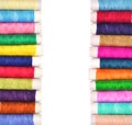 Pile of coloured bobbins of lurex thread isolated on white Royalty Free Stock Photo