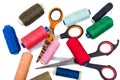 Pile, coloured bobbins of thread with scissors Royalty Free Stock Photo