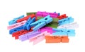 A pile of coloured wooden clothes clips isolated Royalty Free Stock Photo