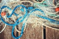 Pile of commercial fishing net with cords and floats Royalty Free Stock Photo