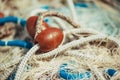 Pile of commercial fishing net with cords and floats Royalty Free Stock Photo