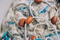 Pile of commercial fishing net with cords and floats Royalty Free Stock Photo