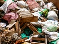 Pile of construction and demolition solid waste inside a container ready to be disposed on a special site solid waste management Royalty Free Stock Photo