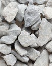 Pile of construction gravel stone lie in group, gray rock gravel show close up texture and dust, object design. White background Royalty Free Stock Photo