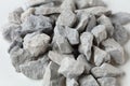 Pile of construction gravel stone lie in group, gray rock gravel show close up texture and dust, object design. White background Royalty Free Stock Photo