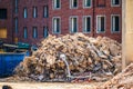 Pile of construction rubble outside brick building.. Royalty Free Stock Photo