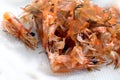 Pile of cooked and peeled shrimp, waste food shrimp peeled, detail of the heads and eyes of this seafood