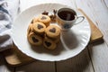 Pile of cookies along with a cup of coffee in a white plate Royalty Free Stock Photo