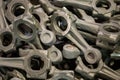 Pile of crankshaft connecting rod forgings after cooling and shot blasting operations, close-up with selective focus Royalty Free Stock Photo