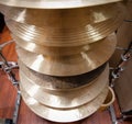 Pile of crash cymbal drum plates