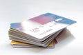 Pile of credit cards on white background