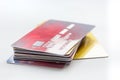 Pile of credit cards on white background