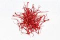 Pile of crocus saffron threads close up on gray Royalty Free Stock Photo