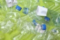 Pile of crumpled empty plastic bottles on color background Royalty Free Stock Photo