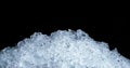 Pile of crushed ice cubes on dark background with copy space. Crushed ice cubes foreground for beverages Royalty Free Stock Photo