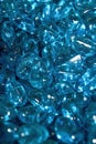 Pile of crystal clear blue glass stones close-up Royalty Free Stock Photo