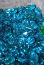 Pile of crystal clear blue glass stones close-up Royalty Free Stock Photo