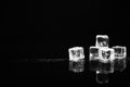 Pile of crystal clear ice cubes on black. Space for text Royalty Free Stock Photo