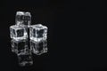 Pile of crystal clear ice cubes on black background Royalty Free Stock Photo
