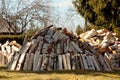 A pile of cut firewood drying in springlike  weather Royalty Free Stock Photo