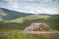 Pile of cut timber logs,along Applecross Pass,Highlands of Scotland,UK