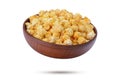 A pile of delicious caramel popcorn in a falling plate, isolated on a white background