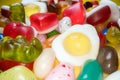 Pile of delicious colorful chewing candies background. Colourful sweets on yellow background Royalty Free Stock Photo