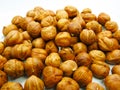 Pile of Hazelnuts on White Background. Royalty Free Stock Photo