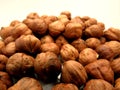 Pile of Peeled Hazelnuts on White Background. Royalty Free Stock Photo