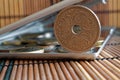 Pile of Denmark coins with a denomination of five krone (crown) in mirror reflect wallet lies on wooden bamboo table background - Royalty Free Stock Photo