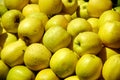 A pile of dewily yellow apples