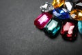 Pile of different beautiful gemstones on background, closeup. Space for text