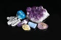 Pile of different beautiful gemstones on background