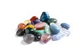 Pile of different beautiful gemstones on white