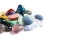 Pile of different beautiful gemstones on white