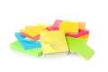 Pile of different colorful sticky notes on white background. School stationery Royalty Free Stock Photo