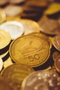 Pile of different gold coins on the table. Greek coin Drachma Royalty Free Stock Photo