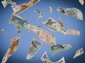 Pile of different international currency bills are seen floating in the air