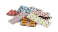 Pile of different pills in blister packs on white background Royalty Free Stock Photo