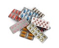 Pile of different pills in blister packs on white Royalty Free Stock Photo