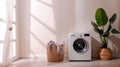 A pile of dirty clothes beside a modern washing machine. Concept of typical household chore of doing laundry.