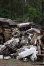 Pile of dirty styrofoam and weathered baulk timber