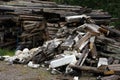 Pile of dirty styrofoam and weathered baulk timber